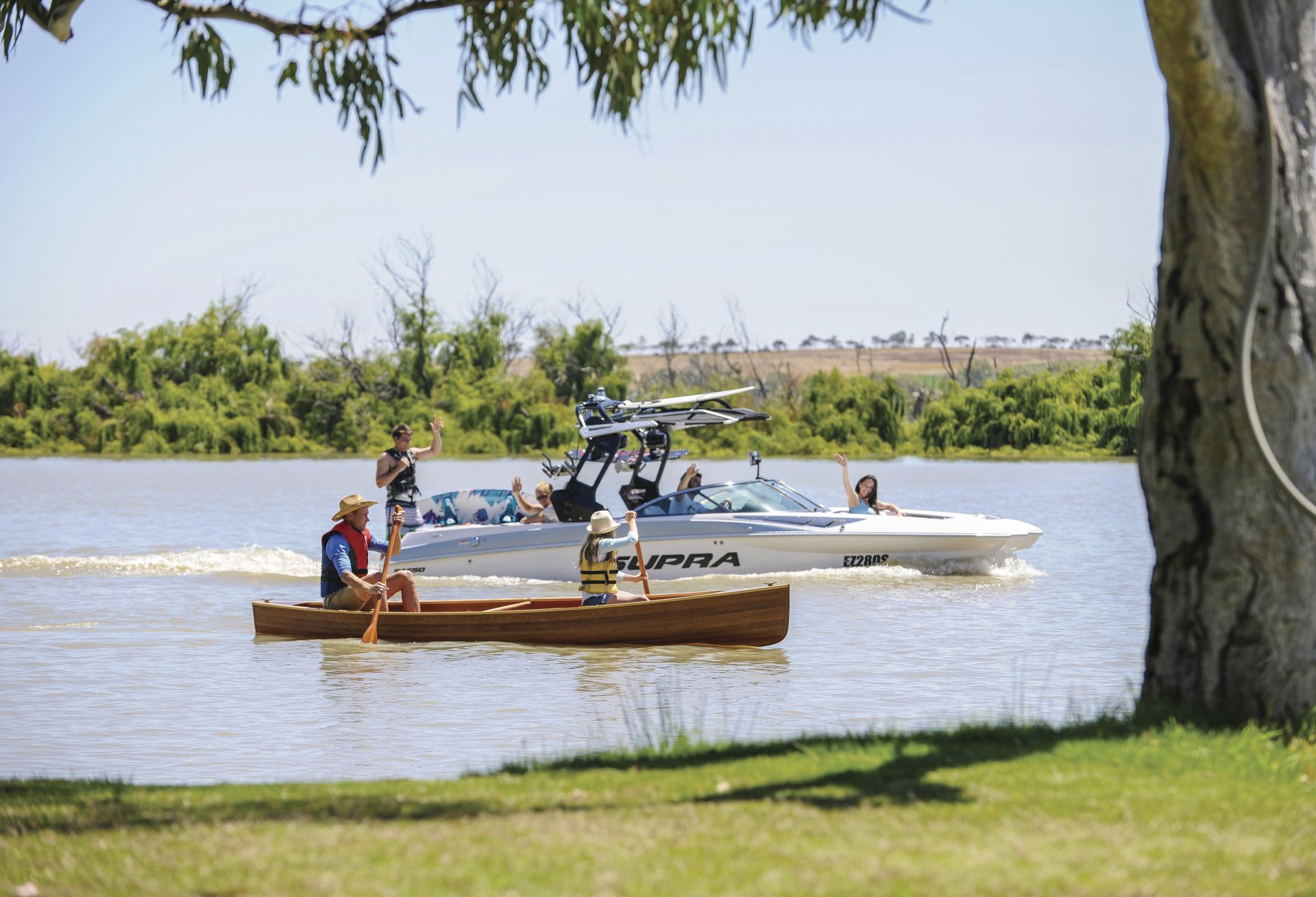 Speed boat and canoe on the river 