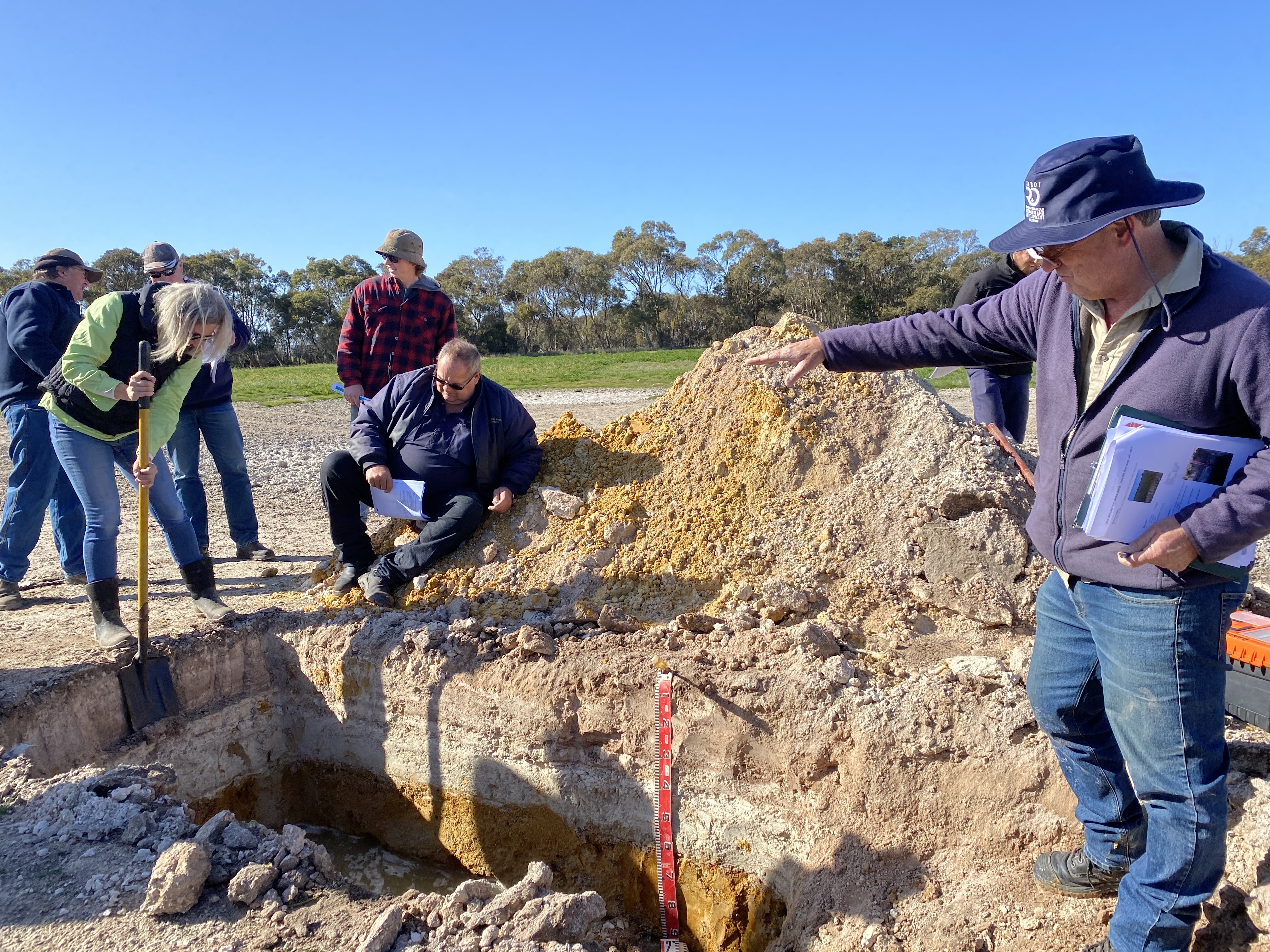 Brian Hughes PIRSA pointing out features of the soil pit Meningie East