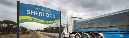 Sherlock Welcome Sign - Passing Truck in Background - website banner