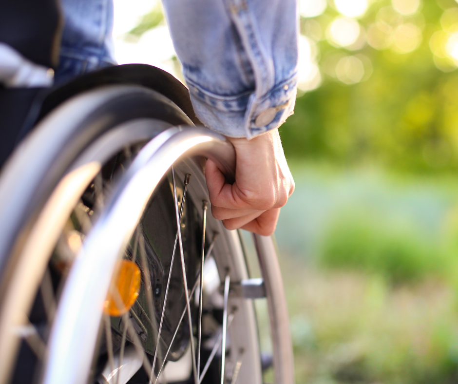 DAIP - social tile2 - close up of someones hands on the wheel of a wheelchair